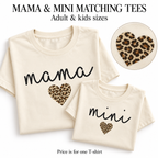 Matching natural Mama and Mini T-shirts with black script lettering and leopard-print heart designs.