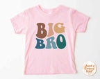 Pink t-shirt with 'BIG BRO' text on a white background