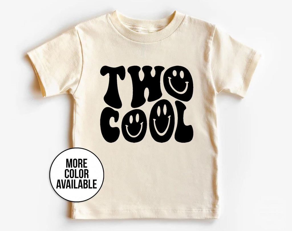 Beige t-shirt with 'Two Cool' text on a white background