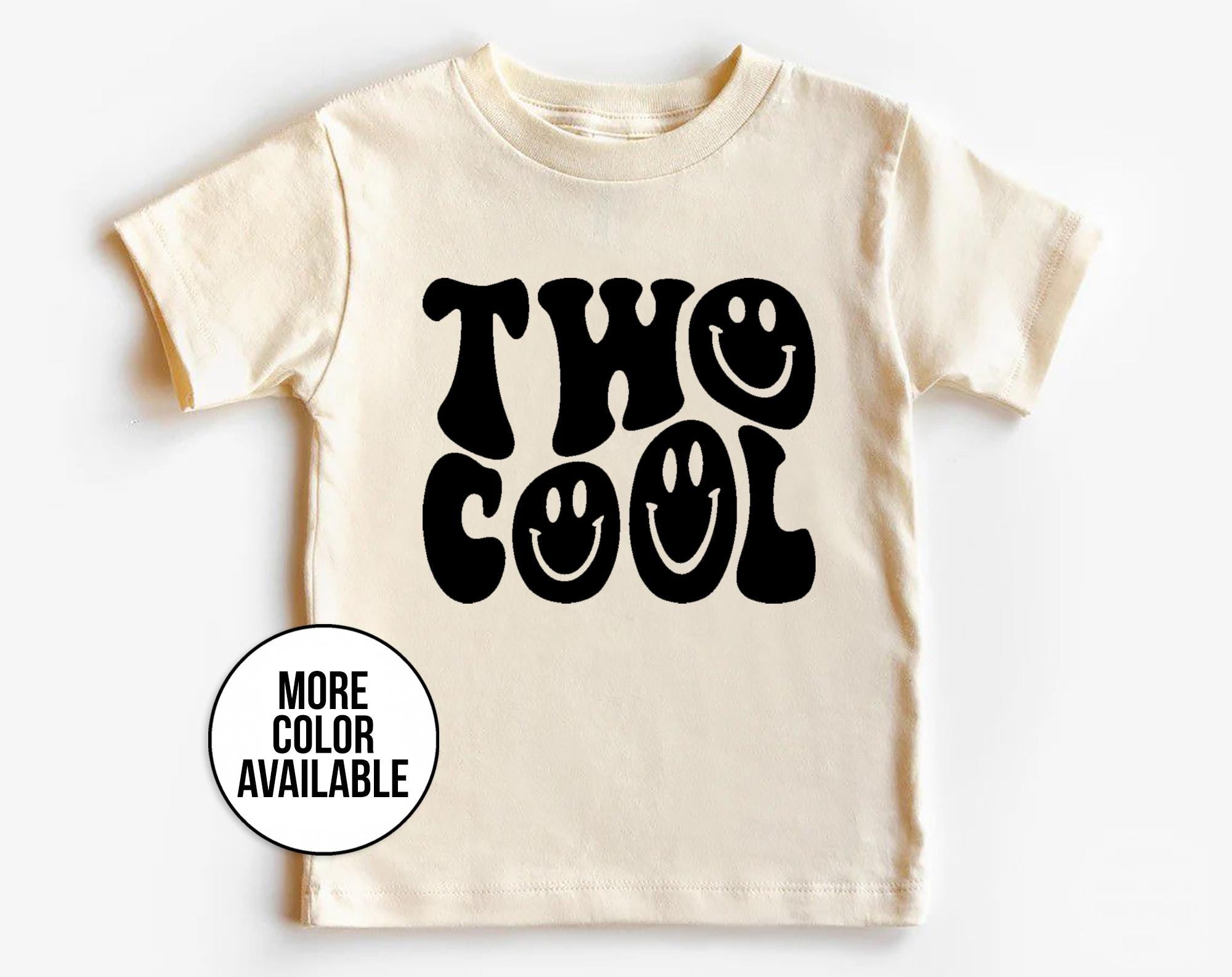 Beige t-shirt with 'Two Cool' text on a white background